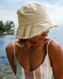 T&C Sea Breeze Beach Hat in Natural woven straw close up view highlighting the dense front logo embroidery thread and internal moisture wicking performance sweatband, sold by Point Break Cambridge local family surf shop at 63 Duke street.