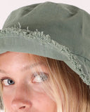T&C Sea Breeze Beach Hat in Teal woven straw close up view highlighting the dense front logo embroidery thread and internal moisture wicking performance sweatband, sold by Point Break Cambridge local family surf shop at 63 Duke street.