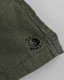 T&C Whaler Cord Short in Military green close up view highlighting the thick premium cotton corduroy fabric ridges metallic hardware details and internal waist lining, sold by Point Break Cambridge local family surf shop at 63 Duke street.