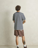 Model wearing the Rhythm Textured Linen Jam Short - Chocolate on a plain background