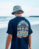 The Mad Hueys Dragon Captain SS Tee in Navy blue back view showing the relaxed straight silhouette and bold oversized custom nautical dragon art graphic print, sold by Point Break Cambridge local family surf shop at 63 Duke street.