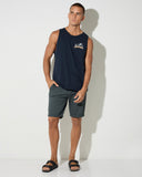 The Mad Hueys Drunken Treasure Tank in Navy blue front view showing the comfortable scoop neck sleeveless design and signature chest brand graphic logo print, sold by Point Break Cambridge local family surf shop at 63 Duke street.