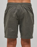 Back view of The Mad Hueys Skull Anchor Youth 15 inch Volley Shorts in Charcoal highlighting the rear pocket setup and relaxed fit.