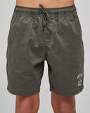 Front view of The Mad Hueys Skull Anchor Youth 15 inch Volley Shorts in Charcoal showing the elastic waist and woven leg patch.
