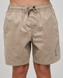 Front view of The Mad Hueys Skull Anchor Youth 15 inch Volley Shorts in Taupe showing the elastic waist and woven leg patch.