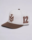 The Mad Hueys New Hueys Twill Snapback in White side profile view showing the clean crown alignment and stitched white ventilation eyelets, sold by Point Break Cambridge local family surf shop at 63 Duke street.