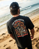 The Mad Hueys Shield Fk Off SS Tee in Vintage Black back view showing the relaxed straight silhouette and bold oversized custom shield brand artwork graphic print, sold by Point Break Cambridge local family surf shop at 63 Duke street.