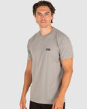 Man wearing a gray t-shirt with a logo on a white background