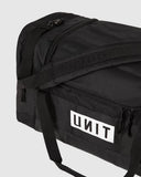 Unit Stack Duffle Bag close up view highlighting the premium high density fabric texture woven carry handles metal hardware and open main compartment storage, sold by Point Break Cambridge local family surf shop at 63 Duke street.