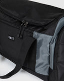 Unit Trail Duffle Bag close up view highlighting the premium high density fabric texture woven carry handles metal hardware and open main compartment storage, sold by Point Break Cambridge local family surf shop at 63 Duke street.