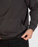 Unit Unisex Central Hoodie in Washed Black close up view highlighting the premium soft cotton fleece fabric weave internal brushed lining texture and high density screen print graphic detail, sold by Point Break Cambridge local family surf shop at 63 Duke street.