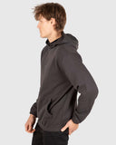 Unit Unisex Central Hoodie in Washed Black side profile view showing the comfortable sleeve drape depth and snug ribbed wrist cuff layout, sold by Point Break Cambridge local family surf shop at 63 Duke street.