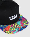 Unit Youth Remix Flat Peak Snapback Hat in Black close up view highlighting the dense raised front logo embroidery thread and internal performance structural sweatband tape detailing, sold by Point Break Cambridge local family surf shop at 63 Duke street.
