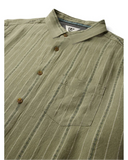 Vissla Linen Pin SS Shirt in Sage green close up view highlighting the premium textured cotton linen fabric weave chest pocket stitching and custom buttons, sold by Point Break Cambridge local family surf shop at 63 Duke street.