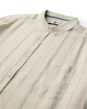 Vissla Lost Coast Short Sleeve Shirt in Vintage White close up view highlighting the premium textured fabric weave chest pocket stitching and custom buttons, sold by Point Break Cambridge local family surf shop at 63 Duke street.