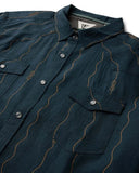 Vissla Round Up Short Sleeve Shirt in Midnight navy close up view highlighting the premium textured fabric weave chest pocket stitching and custom buttons, sold by Point Break Cambridge local family surf shop at 63 Duke street.