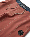 Vissla Roundup 17 Boys Boardshort in Retro Red close up view highlighting the premium recycled stretch fabric texture and durable branded drawcord construction, sold by Point Break Cambridge local family surf shop at 63 Duke street.