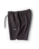Vissla Solid Sets 17.5 Ecolastic Short in Black side profile view showing the modern seventeen point five inch outseam hemline and relaxed leg opening, sold by Point Break Cambridge local family surf shop at 63 Duke street.