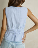 Model wearing the Rhythm Vista Stripe Tie Front Top - Blue on a plain background