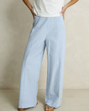 Model wearing the Rhythm Vista Stripe Wide Leg Pant - Blue on a plain background