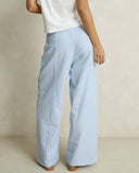 Model wearing the Rhythm Vista Stripe Wide Leg Pant - Blue on a plain background