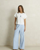 Model wearing the Rhythm Vista Stripe Wide Leg Pant - Blue on a plain background