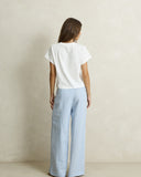 Model wearing the Rhythm Vista Stripe Wide Leg Pant - Blue on a plain background