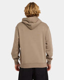 Person wearing a beige hoodie on a white background