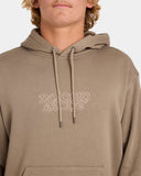 Person wearing a beige hoodie with a brand logo on a white background