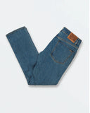 Close up detail of the premium aged indigo denim wash, metal pocket rivets, and Volcom branded hardware.