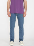 Front view of the Volcom Vorta Denim Slim Fit Jeans in Aged Indigo showing the tailored leg cut and classic zip fly setup.