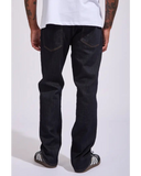 Back view of the Volcom Vorta Denim Slim Fit Jeans in Rinse wash showcasing the signature asymmetric yoke and dark embroidered rear pockets.