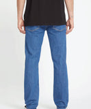 Back view of the Volcom Solver Modern Fit Denim Jeans in BDL wash showcasing the signature asymmetric yoke and stone embroidery on the pocket.