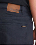 Close up detail of the premium Indigo Wash denim grain, metal rivets, durable stitching, and Volcom branded hardware.