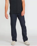Front view of the Volcom Solver Modern Fit Denim Jeans in Indigo Wash showing the straight leg cut and five-pocket setup.
