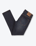 Close up detail of the premium New Vintage Blue denim wash, metal rivets, durable stitching, and Volcom branded hardware.