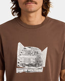 Volcom Cocktail LSE Mens Short Sleeve T-Shirt in Brown Stone close up view highlighting the premium 200gsm cotton jersey texture garment-washed finish detailed dry hand feel screen printed artwork quality stitching and signature Volcom branding, sold by Point Break Cambridge local family surf shop at 63 Duke Street.