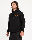 Man wearing a black hoodie with an eagle logo on a white background