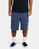 Volcom Mens Disturb Short 21 in Light Navy front view showcasing the relaxed loose-fit silhouette, lightweight 100% nylon fabric, comfortable elasticated drawcord waistband, practical front slash pockets and signature Volcom Stone star print on the left leg, sold by Point Break Cambridge local family surf shop at 63 Duke Street.