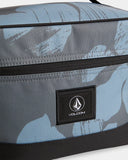 Volcom Patch Attack Deluxe Makeup Bag in Blue close up view showing the open main zipper compartment and internal mesh organizational pockets, sold by Point Break Cambridge local family surf shop at 63 Duke street.