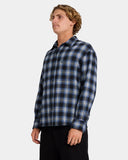 Volcom Psycho Flannel Long Sleeve Shirt in Light Navy side profile view showing the long sleeve cut and buttoned wrist cuffs, sold by Point Break Cambridge local family surf shop at 63 Duke street.