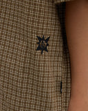 Volcom Revel Youth SS Boys Shirt in Earth brown close up view highlighting the premium lightweight textured woven fabric weave chest pocket stitching and custom buttons, sold by Point Break Cambridge local family surf shop at 63 Duke street.