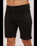 Front view of the Volcom Solver Lite 5 pocket men's 19 inch short in black showing the clean modern fit. Model wearing the shorts.