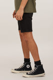 Close-up detail of the lightweight stretch canvas fabric and signature Volcom asymmetrical back yoke detailing.