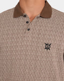 Volcom Stonelord Polo Shirt in Brown Stone close up view highlighting the premium textured knit fabric weave, ribbed collar, and branded two button placket, sold by Point Break Cambridge local family surf shop at 63 Duke street.