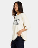 Volcom Womens Mirrorz Tee in Dirty White side profile view showing the comfortable casual short sleeve length and clean flat stitched hemline layout, sold by Point Break Cambridge local family surf shop at 63 Duke street.