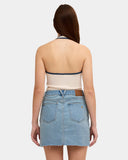 Volcom Womens Ramped Mini Denim Skirt in Stone Blue back view showing the rear pockets signature stone shape yoke stitching and brand logo detailing, sold by Point Break Cambridge local family surf shop at 63 Duke street.
