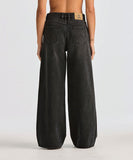 Back view of the Wrangler Mid Stevie relaxed jeans showing the classic five-pocket configuration and vegan paper back patch.