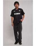 Front view of the XLARGE Football short sleeve tee in black showing the chest athletic logo graphic.