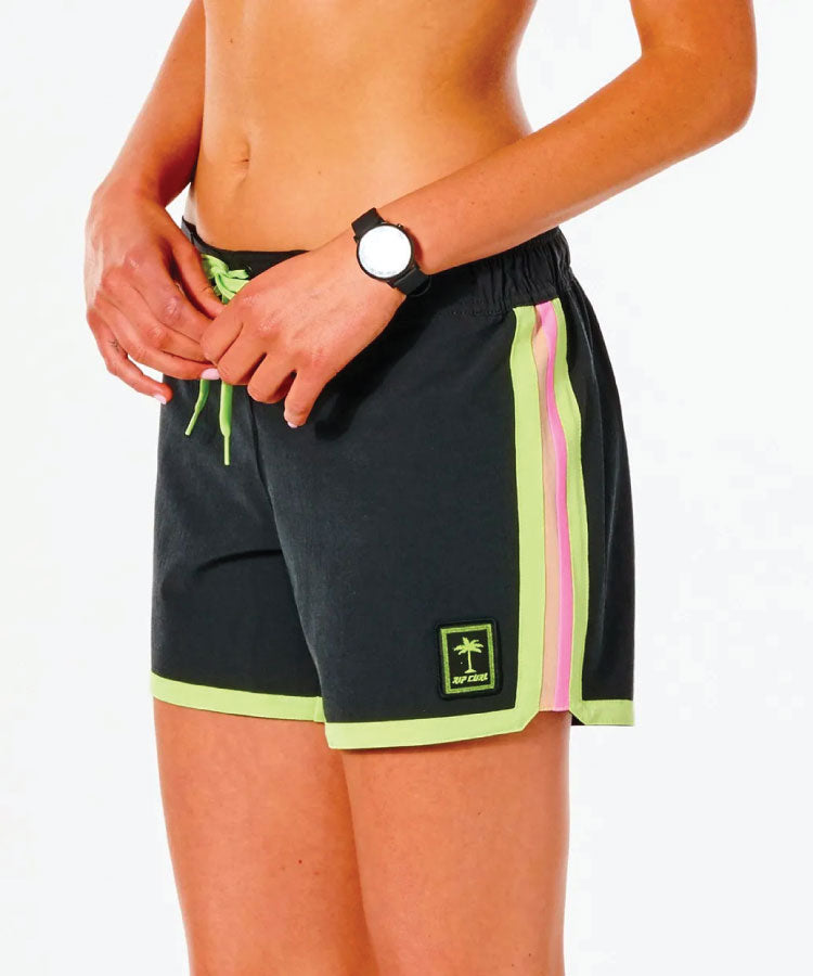 Rip Curl Twin Fin 5" Boardshorts -Black A pair of black and green Rip Curl Twin Fin 5 inch boardshorts with a white logo patch on the back pocket and contrast pop binding.